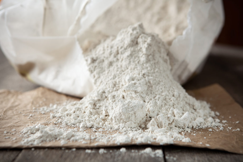 Close-up of Diatomaceous earth on a wooden surface