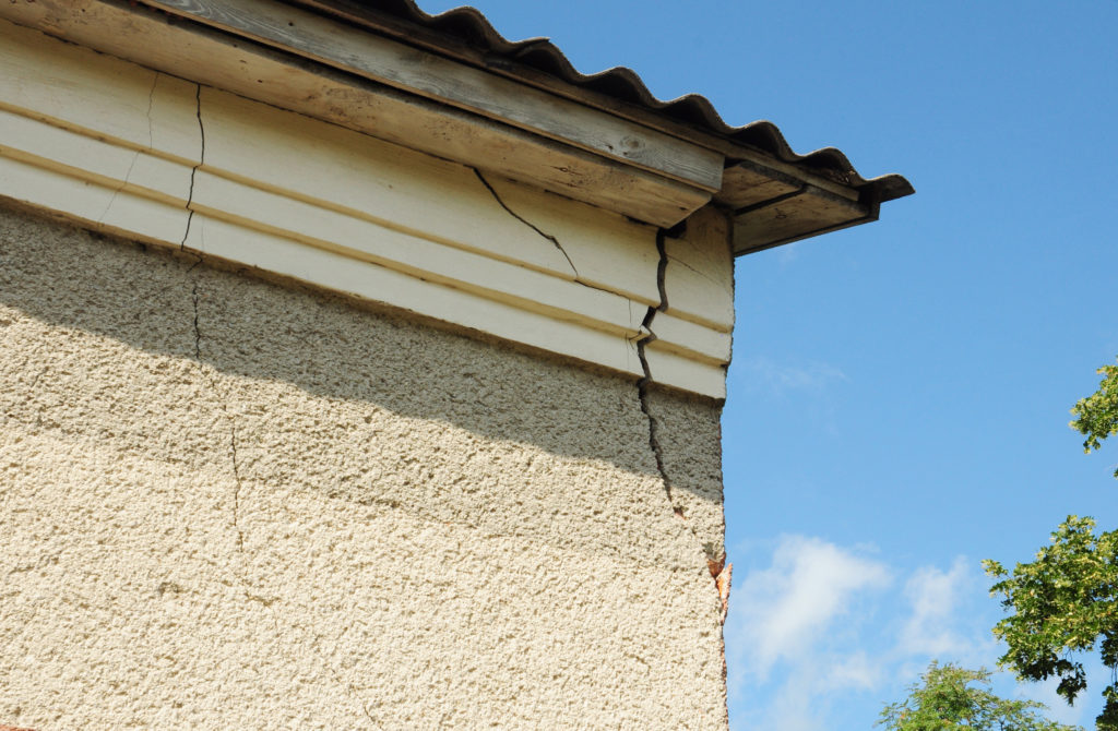 House wall crack on the roof corner.